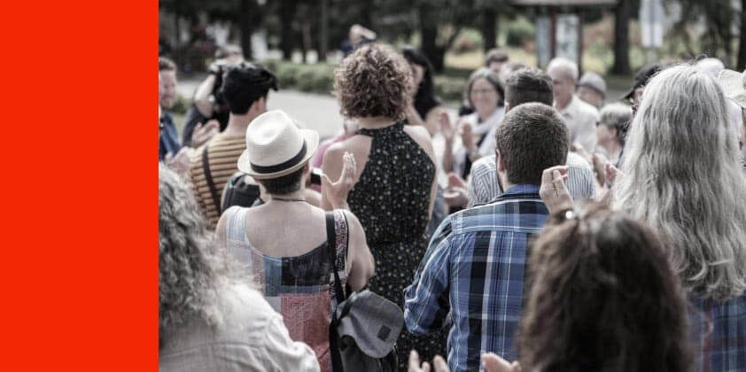 A group of people clapping